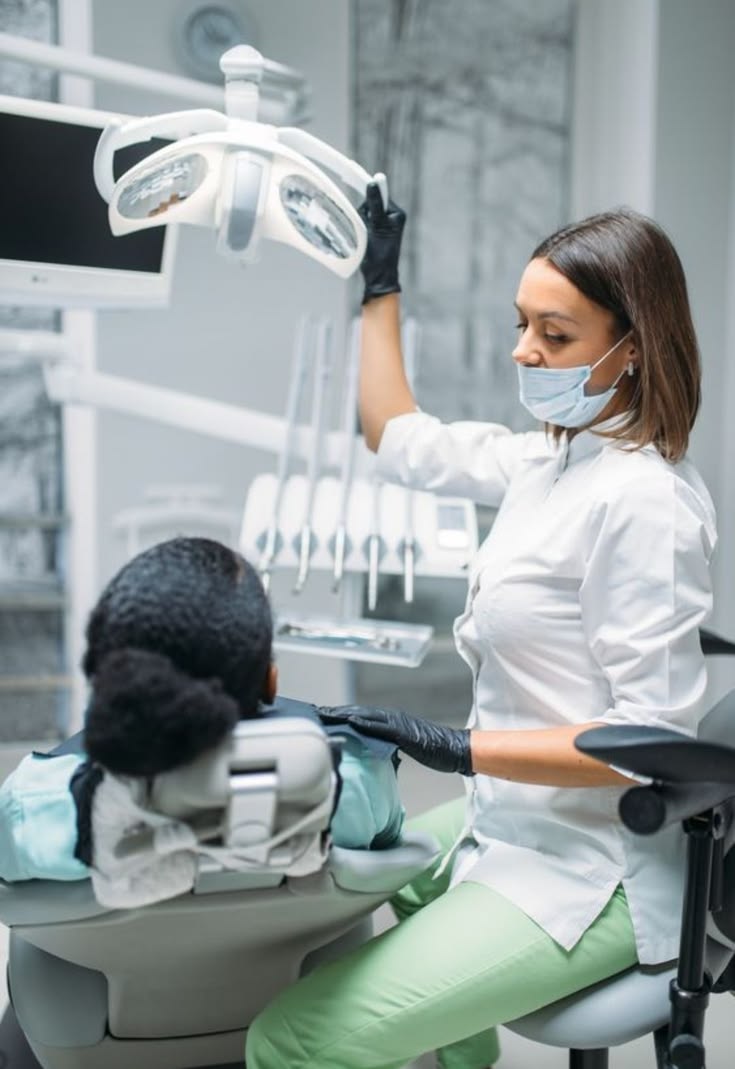 Dentist explaining dental implant treatment