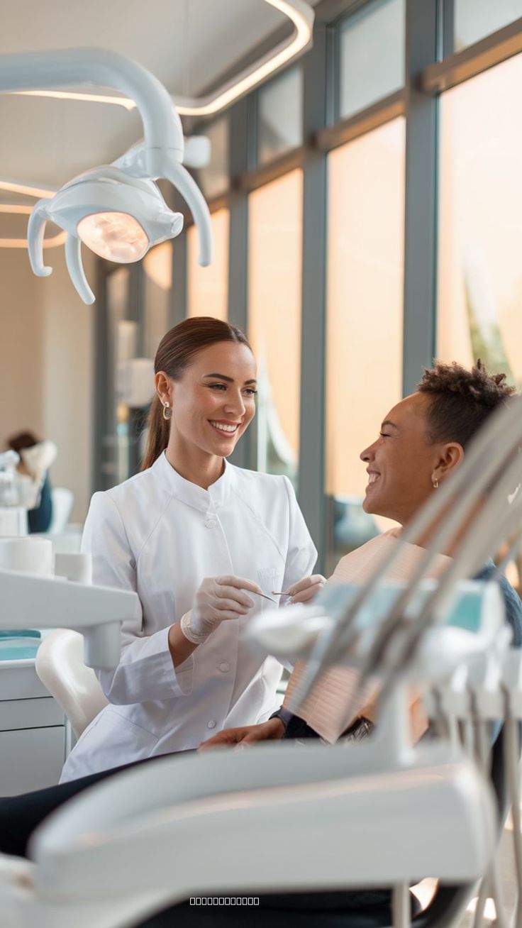 Dentist speaking with a patient in a modern treatment room